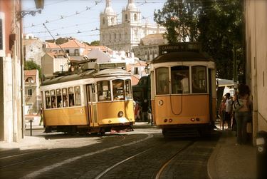 Why is it that a tram can run on one catenary? Why is it that a tram can run on one catenary?